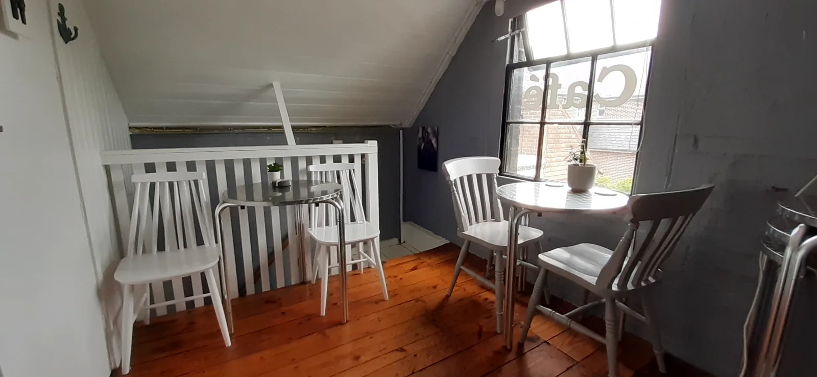 The cosy upstairs seating area at Dennie's Cafe